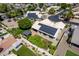 An aerial view of the property with a view of solar panels, backyard pergola and mature landscaping at 6577 W Abraham Ln, Glendale, AZ 85308