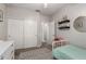 bedroom with a daybed, sliding closet, and decor at 6577 W Abraham Ln, Glendale, AZ 85308