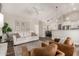 Spacious living room with hardwood floors, comfortable seating, and open layout at 6577 W Abraham Ln, Glendale, AZ 85308