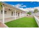 Expansive backyard with lush turf and covered patio for relaxation at 8516 W Saint John Rd, Peoria, AZ 85382