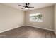 Neutral bedroom with wood flooring, ceiling fan, and a window to bring in light at 8516 W Saint John Rd, Peoria, AZ 85382