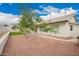 Well-maintained home exterior with mature trees and tidy landscaping at 8516 W Saint John Rd, Peoria, AZ 85382