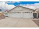 Attractive single-story home featuring a three-car garage and easy-care rock landscaping at 8516 W Saint John Rd, Peoria, AZ 85382