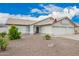 Well-maintained single-story home with three-car garage and drought-tolerant landscaping at 8516 W Saint John Rd, Peoria, AZ 85382