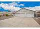Inviting single-story home features a spacious three-car garage and desert rock landscaping at 8516 W Saint John Rd, Peoria, AZ 85382