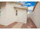 Side yard storage shed exterior with rock landscaping and walkway at 8516 W Saint John Rd, Peoria, AZ 85382