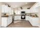 Well-lit kitchen with stainless steel appliances, granite countertops, and ample cabinet space at 8516 W Saint John Rd, Peoria, AZ 85382