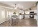Eat-in kitchen featuring stainless appliances, granite counters and bright lighting at 8516 W Saint John Rd, Peoria, AZ 85382