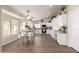 Eat-in kitchen featuring white cabinets, granite counters and stainless steel appliances at 8516 W Saint John Rd, Peoria, AZ 85382