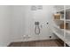 Convenient laundry room with washer and dryer hookups, plus shelving for organized storage at 8516 W Saint John Rd, Peoria, AZ 85382