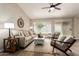 Bright living room featuring a ceiling fan, wood floors and sliding glass door at 8516 W Saint John Rd, Peoria, AZ 85382