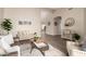 Bright living room with neutral colors, stylish decor, wood floors and open floor plan at 8516 W Saint John Rd, Peoria, AZ 85382