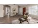 Inviting living room featuring wood floors, neutral paint, and stylish decor throughout at 8516 W Saint John Rd, Peoria, AZ 85382