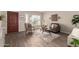 Bright living room featuring contemporary decor, comfortable seating, and modern flooring at 8516 W Saint John Rd, Peoria, AZ 85382