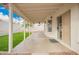 Covered patio with low-maintenance turf, offers indoor/outdoor living at 8516 W Saint John Rd, Peoria, AZ 85382