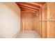 Interior of a storage space with concrete floor and wooden wall frame and shelving at 8516 W Saint John Rd, Peoria, AZ 85382