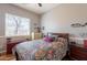 Cozy bedroom with hardwood floors, closet and a window bringing in natural light at 8703 E Nora St, Mesa, AZ 85207