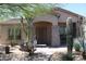 Charming single-story home featuring desert landscaping and a welcoming front porch at 8703 E Nora St, Mesa, AZ 85207