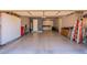 Open garage floorplan with large storage cabinets along the back wall at 8703 E Nora St, Mesa, AZ 85207