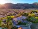 Desert mountain views surround this elegant home with an expansive driveway at 12240 S Honah Lee Ct, Phoenix, AZ 85044