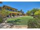 Expansive backyard with lush lawn and patio area, ideal for outdoor enjoyment at 12240 S Honah Lee Ct, Phoenix, AZ 85044