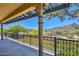 Expansive balcony with iron railings offering stunning views of the surrounding desert landscape and natural beauty at 12240 S Honah Lee Ct, Phoenix, AZ 85044