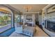 Elegant bedroom with a four-poster bed, cozy seating area, fireplace, and scenic views from the balcony at 12240 S Honah Lee Ct, Phoenix, AZ 85044