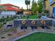 Stone fountain leading up to a grand home with manicured lawn and professional landscaping at 12240 S Honah Lee Ct, Phoenix, AZ 85044