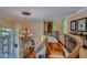 Open foyer features a grand staircase, wrought iron railing, hardwood treads, and a decorative chandelier at 12240 S Honah Lee Ct, Phoenix, AZ 85044