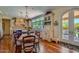 Charming kitchen with custom cabinetry, a central island, hardwood floors, and stainless steel appliances at 12240 S Honah Lee Ct, Phoenix, AZ 85044