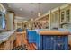 Open concept kitchen with custom cabinetry and a dual island with views of the living spaces and dining room at 12240 S Honah Lee Ct, Phoenix, AZ 85044