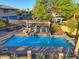 Inviting pool area featuring a waterfall feature and comfortable seating under a pergola at 12240 S Honah Lee Ct, Phoenix, AZ 85044