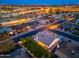 Scenic aerial view of house, manicured lawn and charming neighborhood illuminated at twilight at 2178 E La Jolla Dr, Tempe, AZ 85282