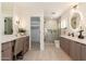 Modern bathroom features double vanity, quartz countertops, and walk-in glass shower at 2178 E La Jolla Dr, Tempe, AZ 85282