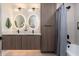 Modern bathroom featuring dual sinks, a vanity, and a shower/tub combo at 2178 E La Jolla Dr, Tempe, AZ 85282