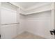 Bright walk-in closet with double shelving and clean white walls at 2178 E La Jolla Dr, Tempe, AZ 85282