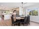 Bright dining room featuring a table and chairs and an open view to the kitchen area at 2178 E La Jolla Dr, Tempe, AZ 85282