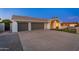 Contemporary home featuring a spacious driveway, two-car garage, and nicely landscaped front yard at 2178 E La Jolla Dr, Tempe, AZ 85282