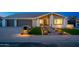 Inviting front entrance with a well-lit walkway, manicured lawn, and modern landscaping at 2178 E La Jolla Dr, Tempe, AZ 85282