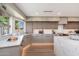 Well-lit kitchen features quartz countertops, ample cabinet space, and stainless steel appliances at 2178 E La Jolla Dr, Tempe, AZ 85282