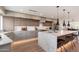 Stylish kitchen with center island, pendant lighting, and light wood flooring, perfect for entertaining at 2178 E La Jolla Dr, Tempe, AZ 85282