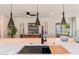 Open concept kitchen island with pendant lighting and a view to dining area at 2178 E La Jolla Dr, Tempe, AZ 85282