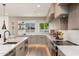 A modern kitchen design with white countertops, a corner window, and stainless steel appliances at 2178 E La Jolla Dr, Tempe, AZ 85282