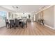 Spacious living and dining area with hardwood floors, contemporary lighting, and stylish decor at 2178 E La Jolla Dr, Tempe, AZ 85282