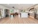 Open-concept living space with a modern kitchen, dining area, foosball table, and comfortable seating area at 2178 E La Jolla Dr, Tempe, AZ 85282