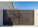 View of the modern horizontal slat metal gate at the side of the home at 2178 E La Jolla Dr, Tempe, AZ 85282