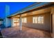 Covered back patio featuring a brick fireplace and views to the back yard at 2178 E La Jolla Dr, Tempe, AZ 85282