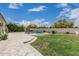 Backyard featuring a lush lawn, patio, and outdoor seating for relaxation and entertainment at 21840 N 260Th Ln, Buckeye, AZ 85396