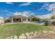 Expansive backyard showcasing green lawn, a pool, patio area, and overall outdoor living space at 21840 N 260Th Ln, Buckeye, AZ 85396