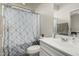 Bathroom features a shower and tub combination, a vanity with sink and a large mirror at 21840 N 260Th Ln, Buckeye, AZ 85396